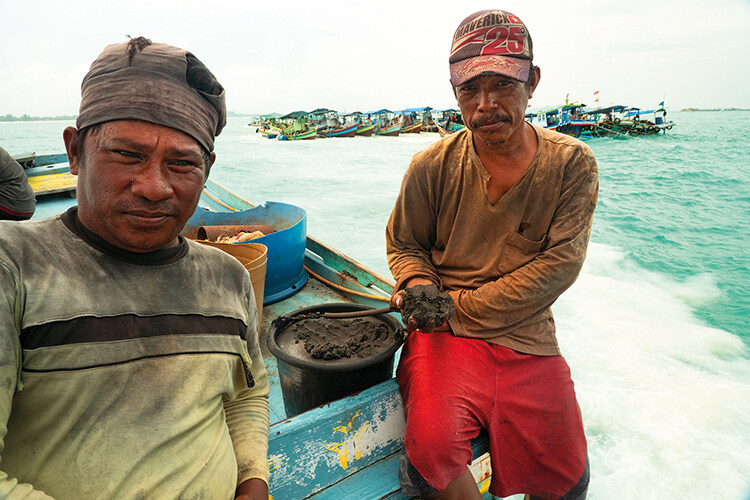 Two former fishermen who have turned to tin mining