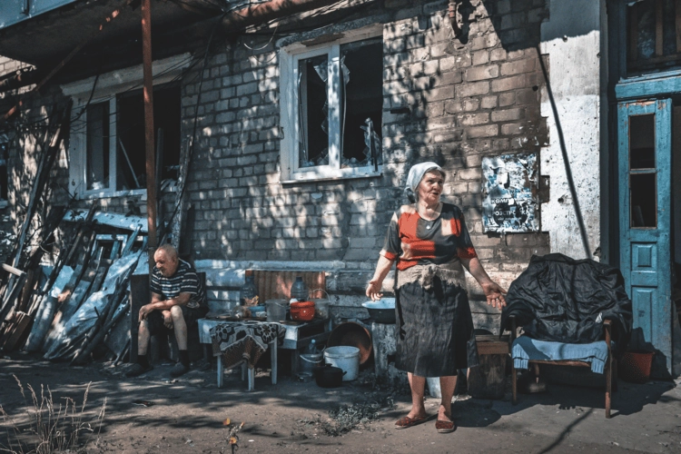 Nina stood outside her home in Ukraine.