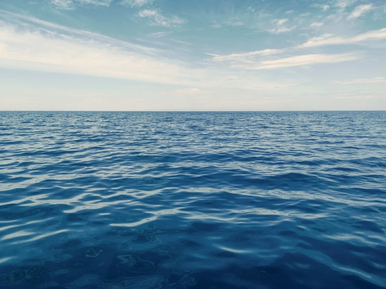 Ocean waters with horizon in background
