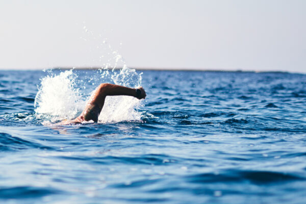 Person swimming in ocean