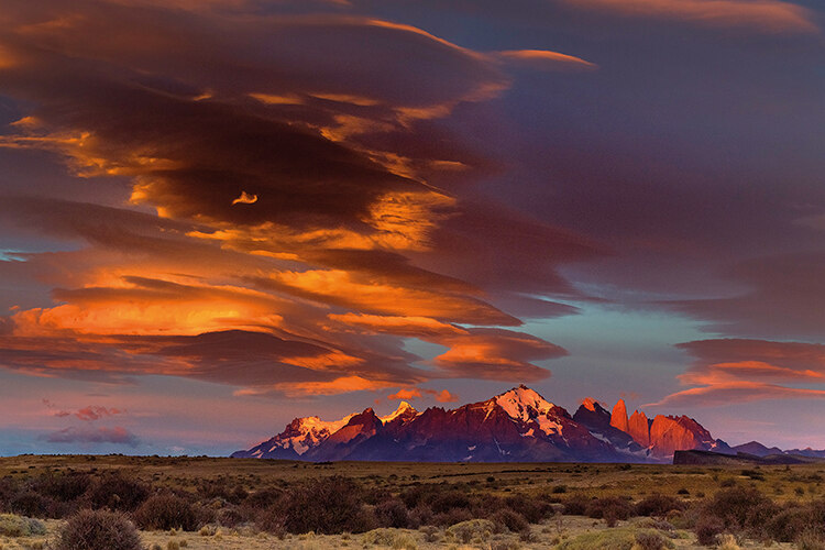 Sunset illuminates Torres del Paine’s eponymous granite towers, which rise precipitously from the steppe