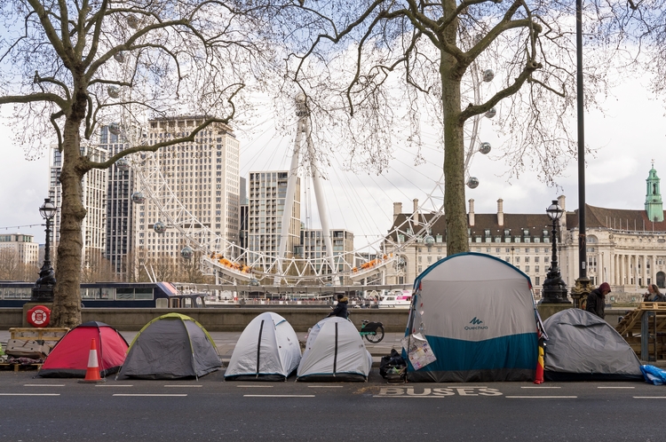 People experiencing homelessness inside tents in London