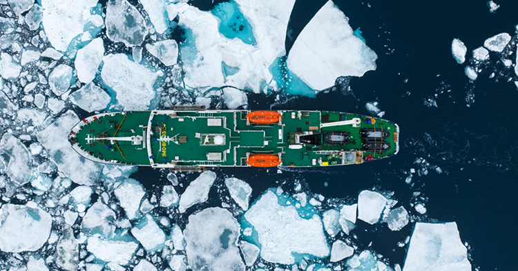 A small expedition ship chartered by Polar Routes breaks through Antarctic sea ice