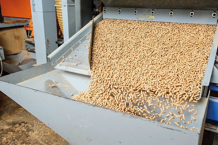 Wood pellets being produced at a timber mill