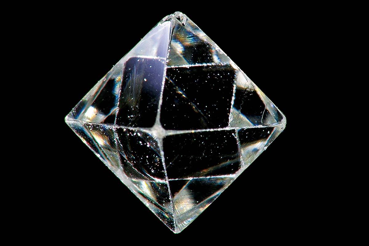 Clear diamond against black background