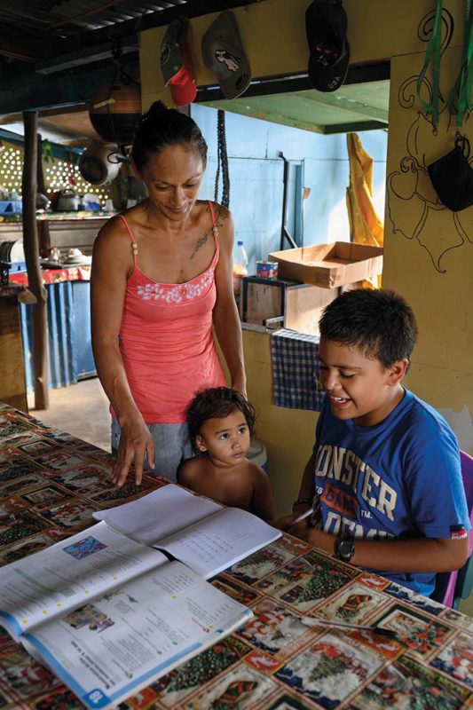 Nikodem and mother looking at homework