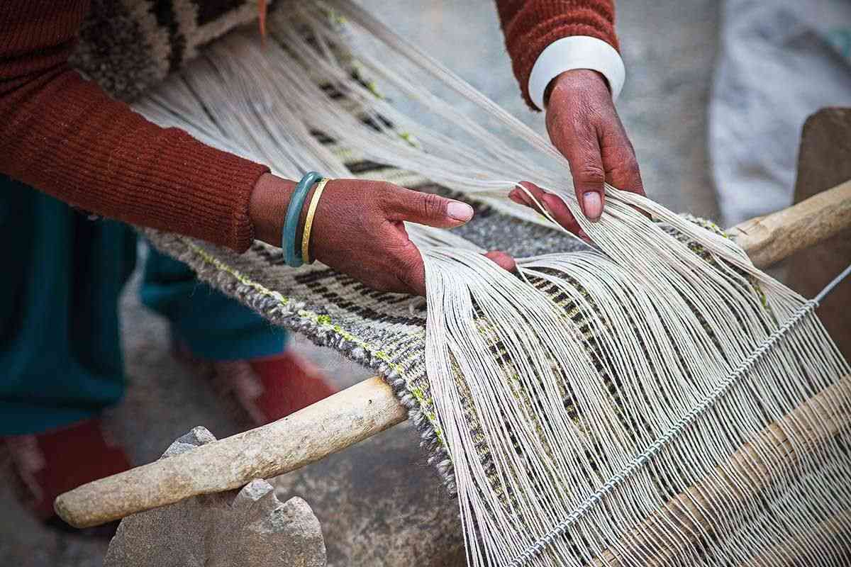 Close up of a Changpa woman weaving 