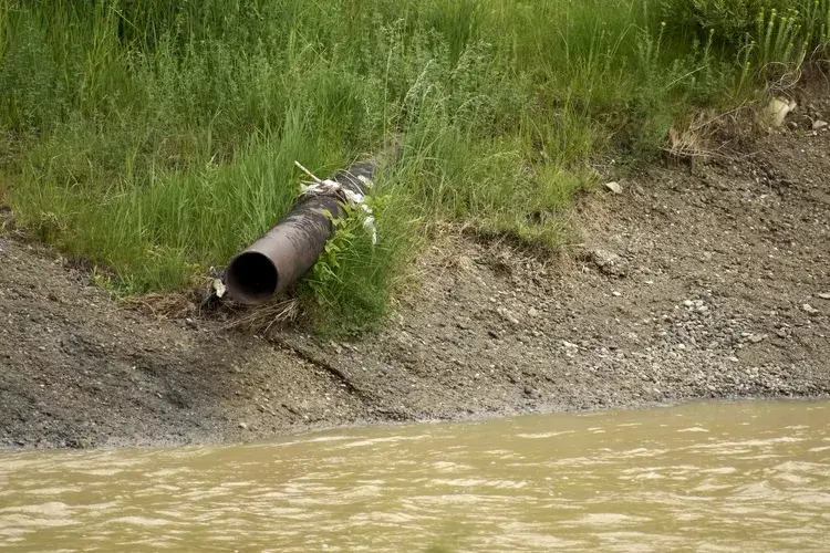 Sewage wastewater draining into water
