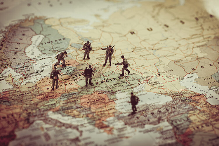 Concept art of toy soilders standing around Ukraine and surrounding area on world map