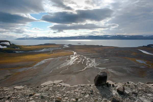 Arctic region covered with no snow or ice, a familiar scene with climate change