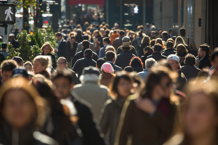 Humans walking on a buay street