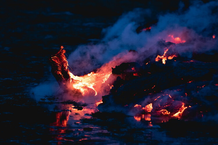 Volcano hot lava field steaming at night close up in Iceland Geldingadalir