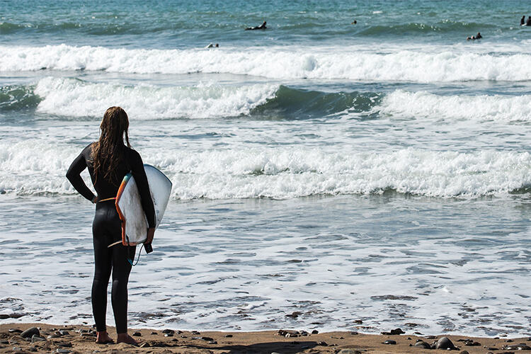 Surfers at Black Rock Beach, Bude, North Cornwall