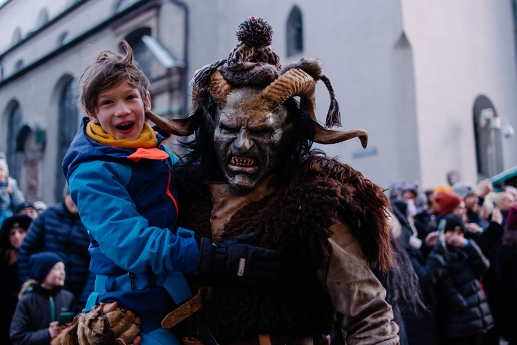 Procession of the Krampus Bavarian tradition in Germany. Costume parade fashing procession. Scary demon make-up with horns for halloween. Zombie parade. Terrible scary masks. Folk German folklore