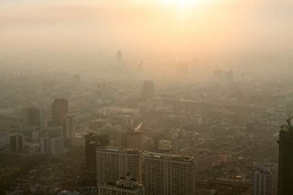 Bad air pollution in City. PM 2.5 dust in Bangkok or center city, Capital city are covered by heavy smog, Misty morning and sunrise in downtown with bad air pollution, Place to risk of cancer, Thailand