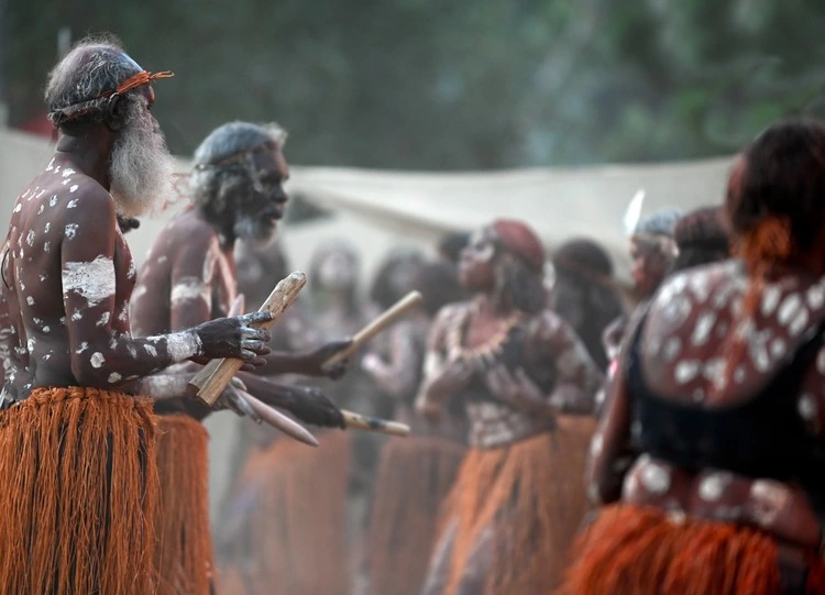 JULY 08 2023:Indigenous Australians men on ceremonial dance in Laura Quinkan Dance Festival Cape York Australia. Ceremonies combine dance, song, rituals, body decorations and costumes