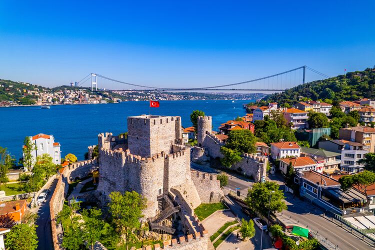 Aerial shot of Fatih Sultan Mehmet Bridge and Anadolu Hisari (Anatolian Fortress) in Istanbul, Turkey.