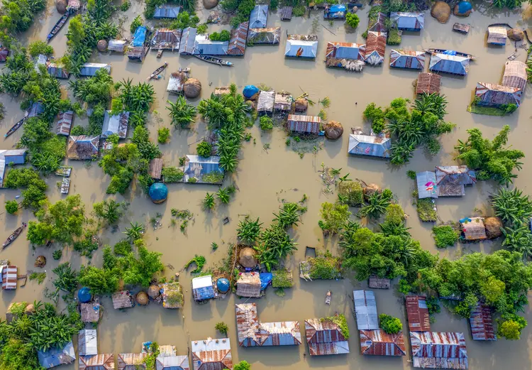 Aerial view of flood affected villages nearby Jamuna river in Northern Bangladesh, highlighting the submerged homes, affected communities, highlighting the severe impact and the resilience