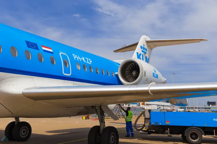 AMSTERDAM - 19 JULY, 2014: An Air France KLM Cityhopper Fokker 70 is being refuelled before the flight to Toulouse.