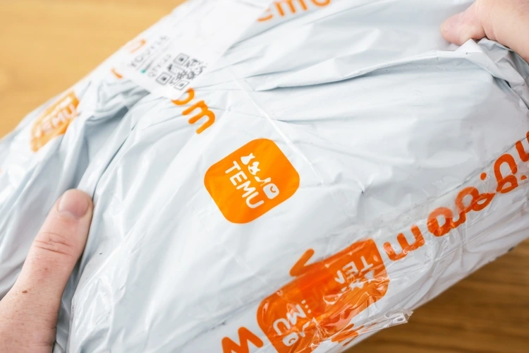 Aachen, Germany - February 21, 2024: Shipping package of TEMU a giant new Chinese mail order company.