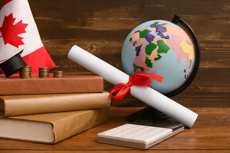 Canada flag with graduation certificate and world