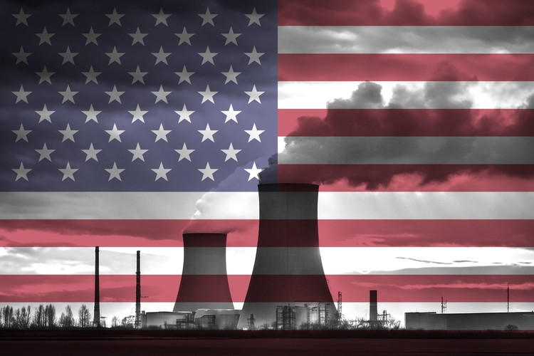 Coal plant silhouette against US flag