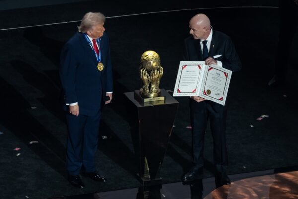 FIFA President Gianni Infantino presents Peace Prize to President Donald Trump during the 2026 FIFA World Cup draw at the John F. Kennedy Center for the Performing Arts in Washington, DC on December 5, 2025.