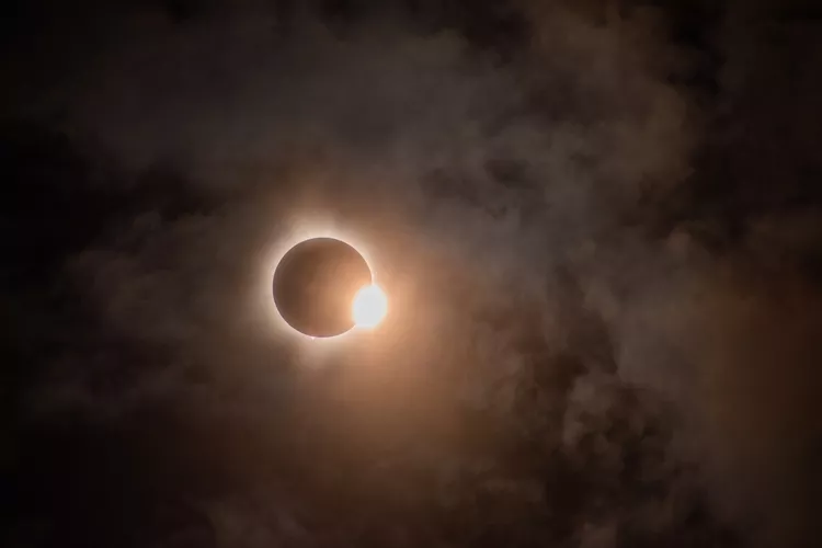 How do solar eclipses affect the weather?