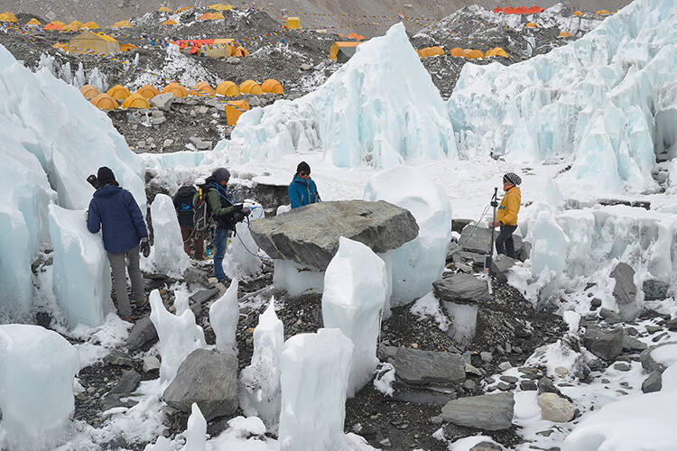 Tenzing and colleagues carry out a deep ground-penetrating survey on the Khumbu glacier, with Everest Base Camp in the background