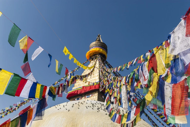 Bodhnath (Boudhanath) Stupa with Brightly Colored Prayer Flags, hoisted at Losar (Tibetan New Year), Kathmandu, Nepal. 