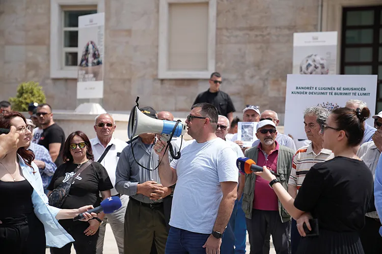 Besjana Guri addressing a protest in Tirana
