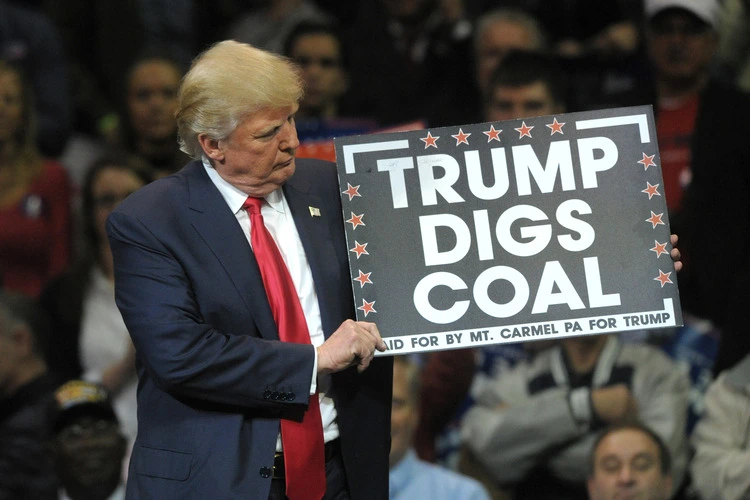 WILKES-BARRE, PENNSYLVANIA/USA – OCTOBER 10, 2016: Republican Presidential nominee Donald Trump holds a 'Trump Digs Coal' sign during a rally Oct. 10, 2016, at Mohegan Sun Arena in Wilkes-Barre, PA.