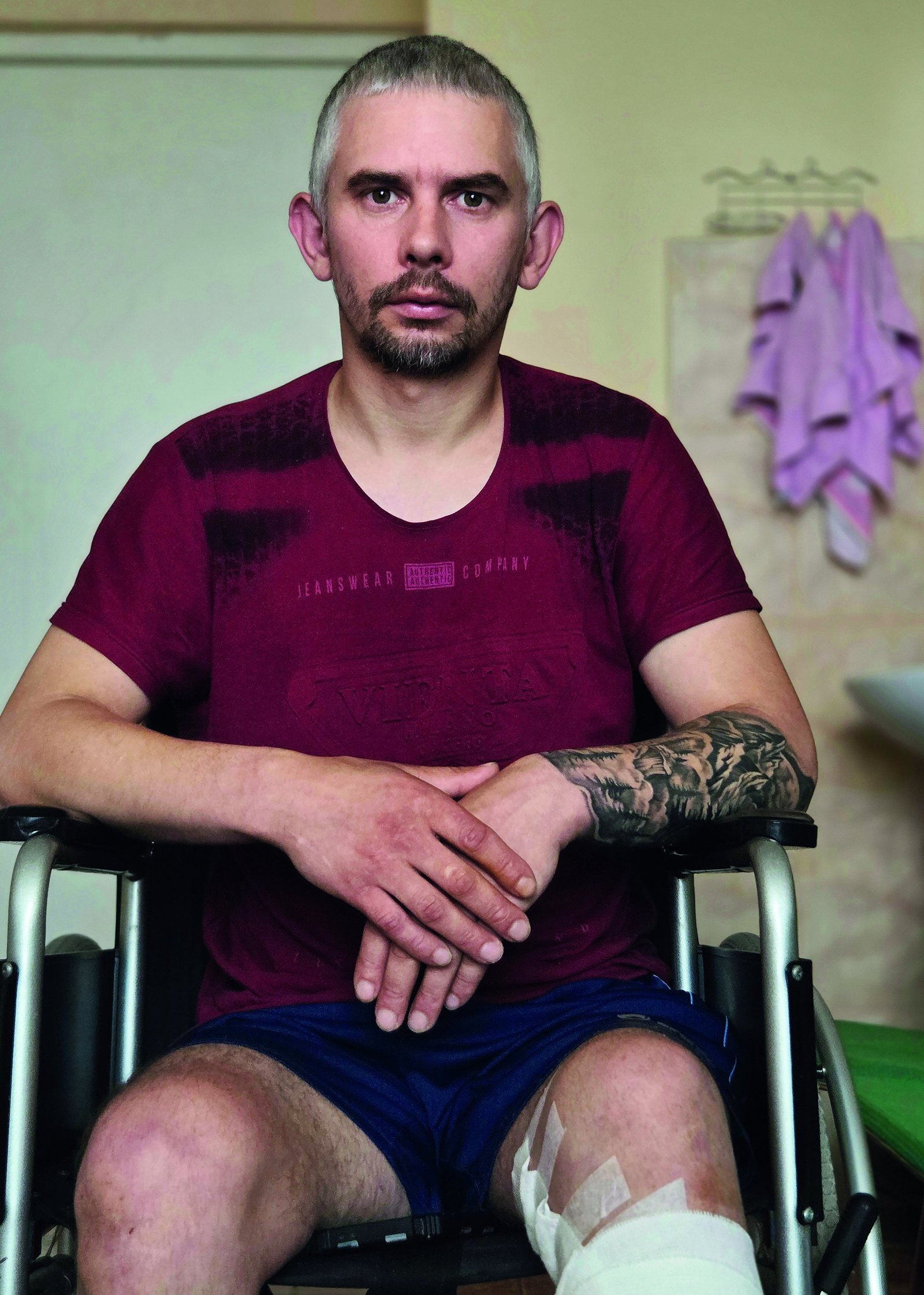 Mihaylo Sahadiak, a wounded Ukrainian veteran, seated in a wheelchair