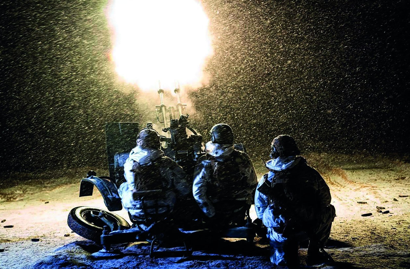 Ukrainian National Guard soldiers firing into the night sky