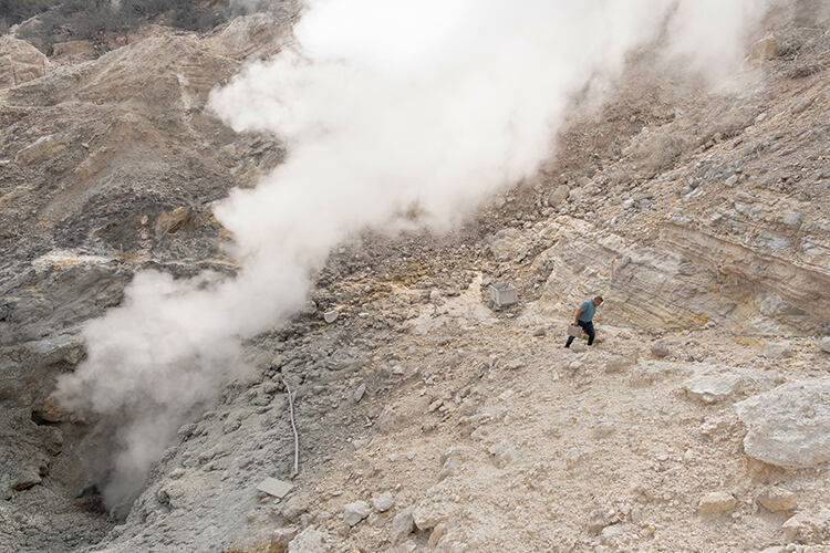 A Vesuvius Observatory researcher collects samples from the the Fumarolle Pisciarelli where gases from the caldera escape