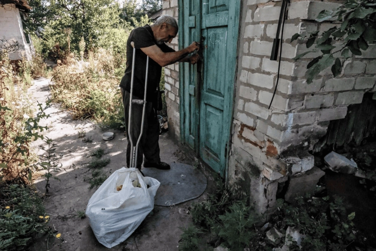 Volodymyr outside his home.