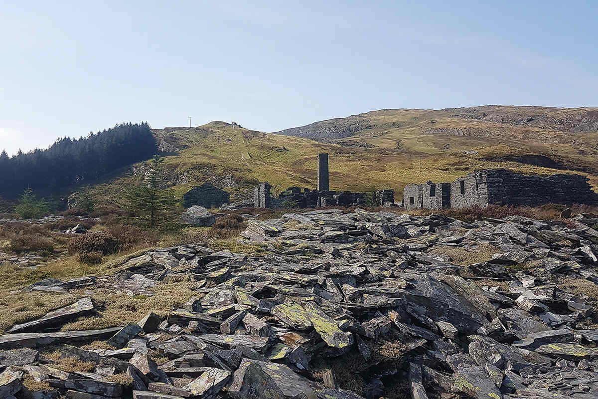 Abandoned slate mine on landscape near Cwm Penmachno