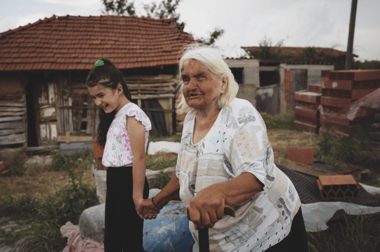 A young girl and her baba (grandmother) on the family farm in Bostane